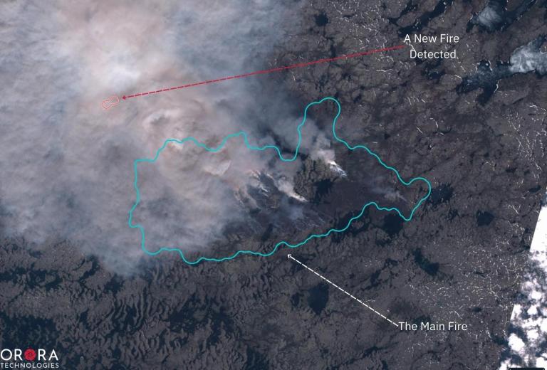 A new fire cluster, spotted under the layer of smoke caused by a more extensive fire. Detected in Quebec, June 2022 by OroraTech's wildfire system through the Sentinel-2 satellite