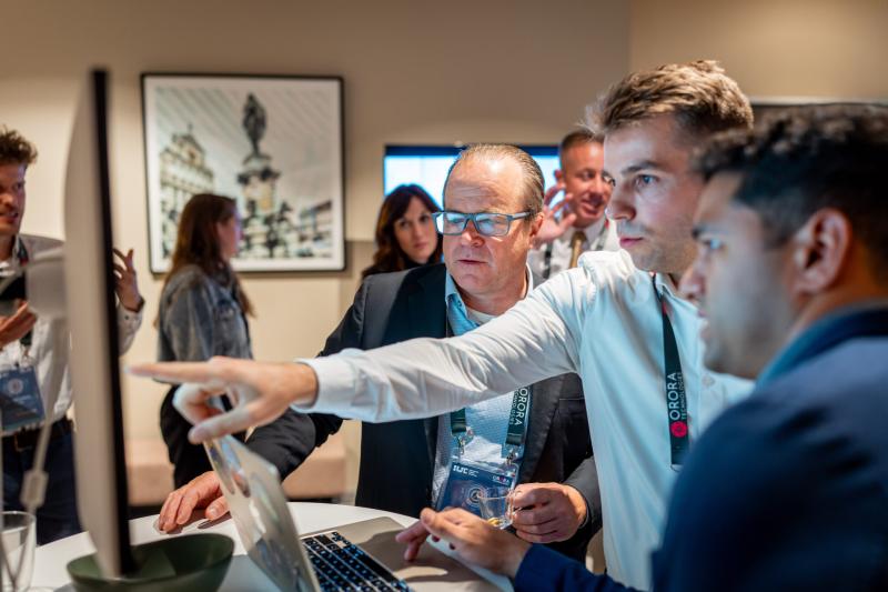 Collin Ratzka (middle) and Steve Maisonet (right) of OroraTech demonstrate Wildfire Solution to Ian McCubbin of NASA JPL during a networking break. 