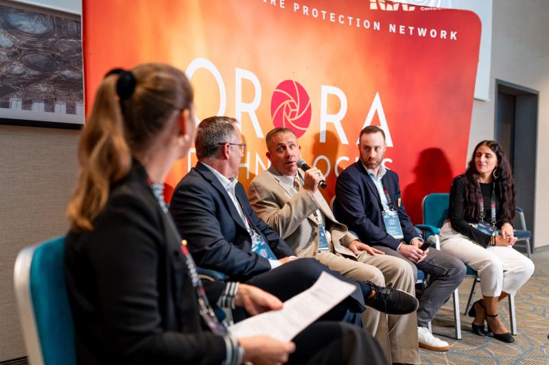 Donald Dillenberger speaks during an expert panel on the use of technology in fire emergencies. Left to right: Kim Feuerbacher, OroraTech / Brian Collins, FireSat / Donald Dillenberger, LA City Fire / Brady Holliday, SOPFEU / Zisoula Ntasiou, Hellenic Fire Corps