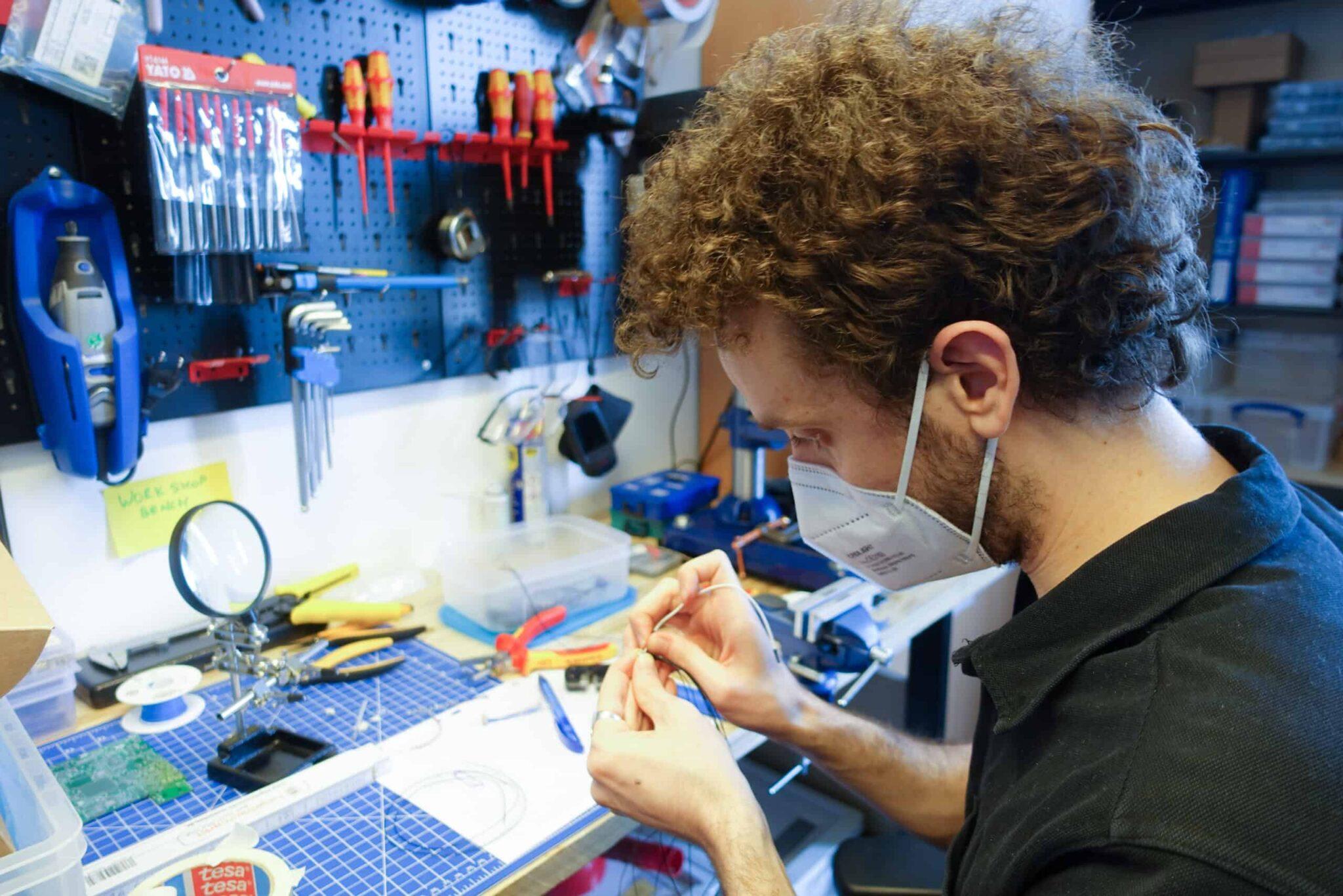 Sofiane Affes works in the electronics lab in our Munich office